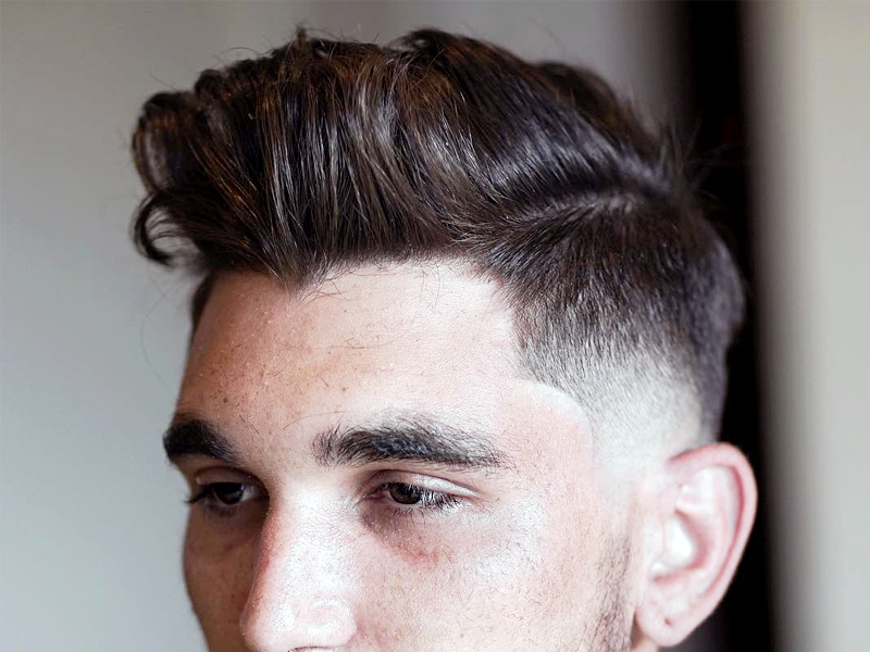 8. Messy Pomp Temple Fade Hair Style