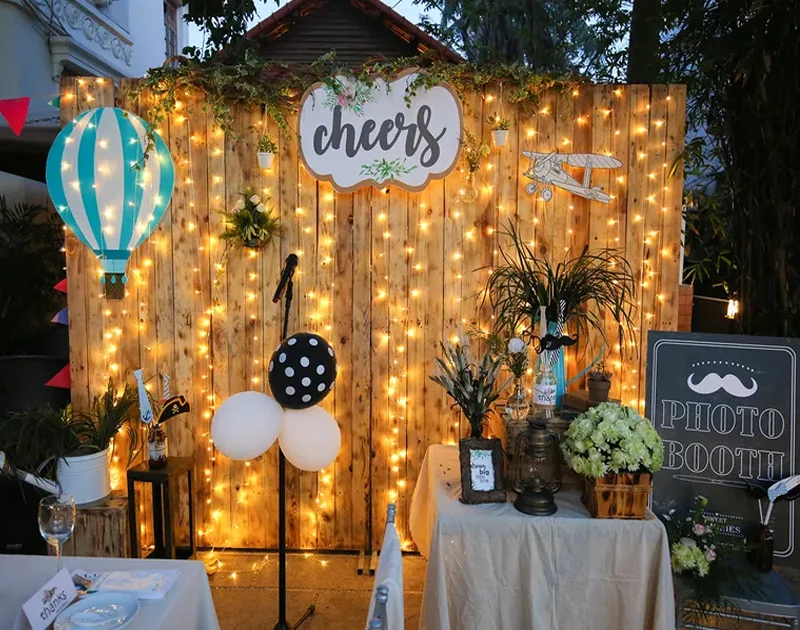 Photo booth with string lights backdrop